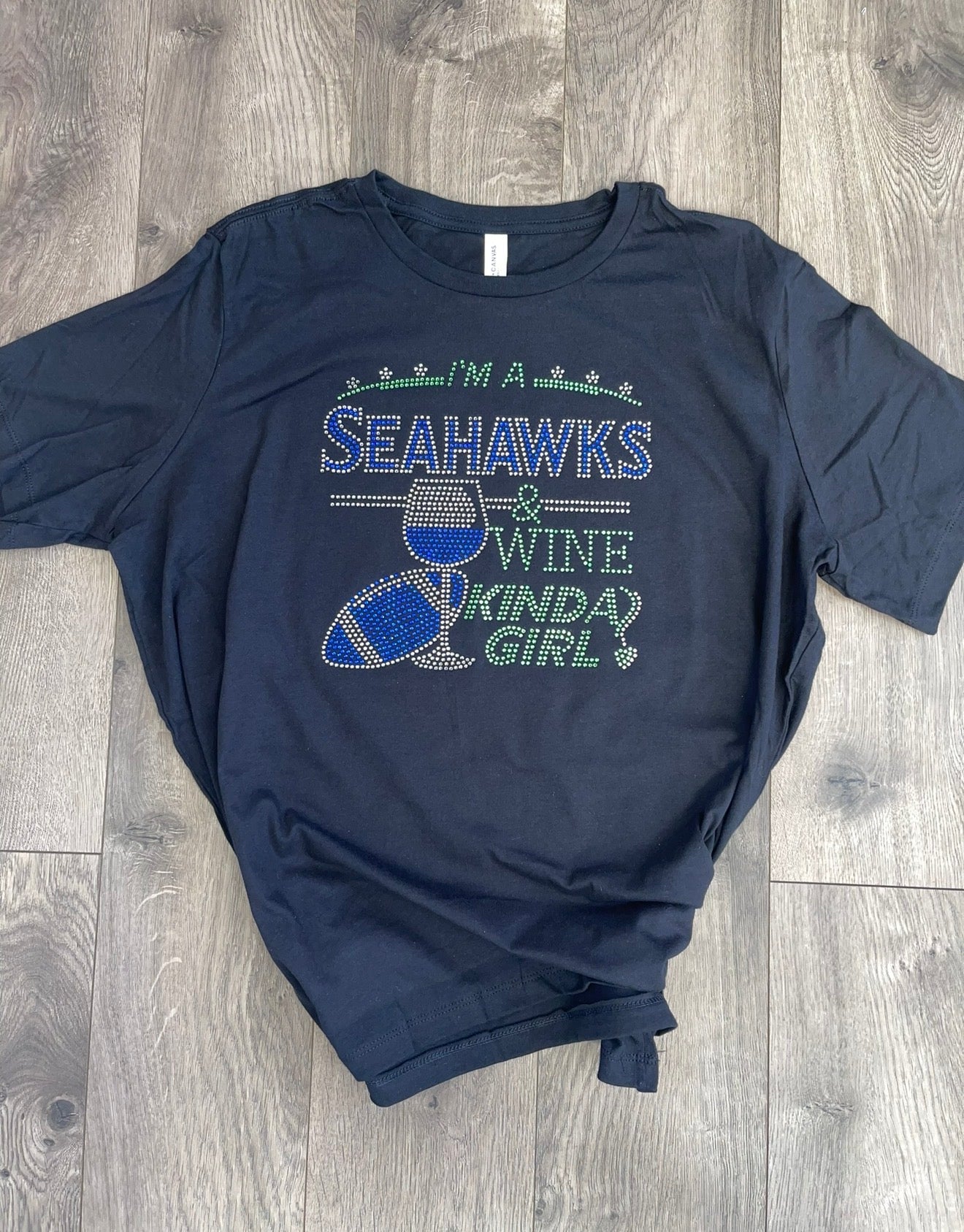 Seahawks and "Wine Kinda Girl" Rhinestone Bella-Canvas crew neck short sleeve shirt.